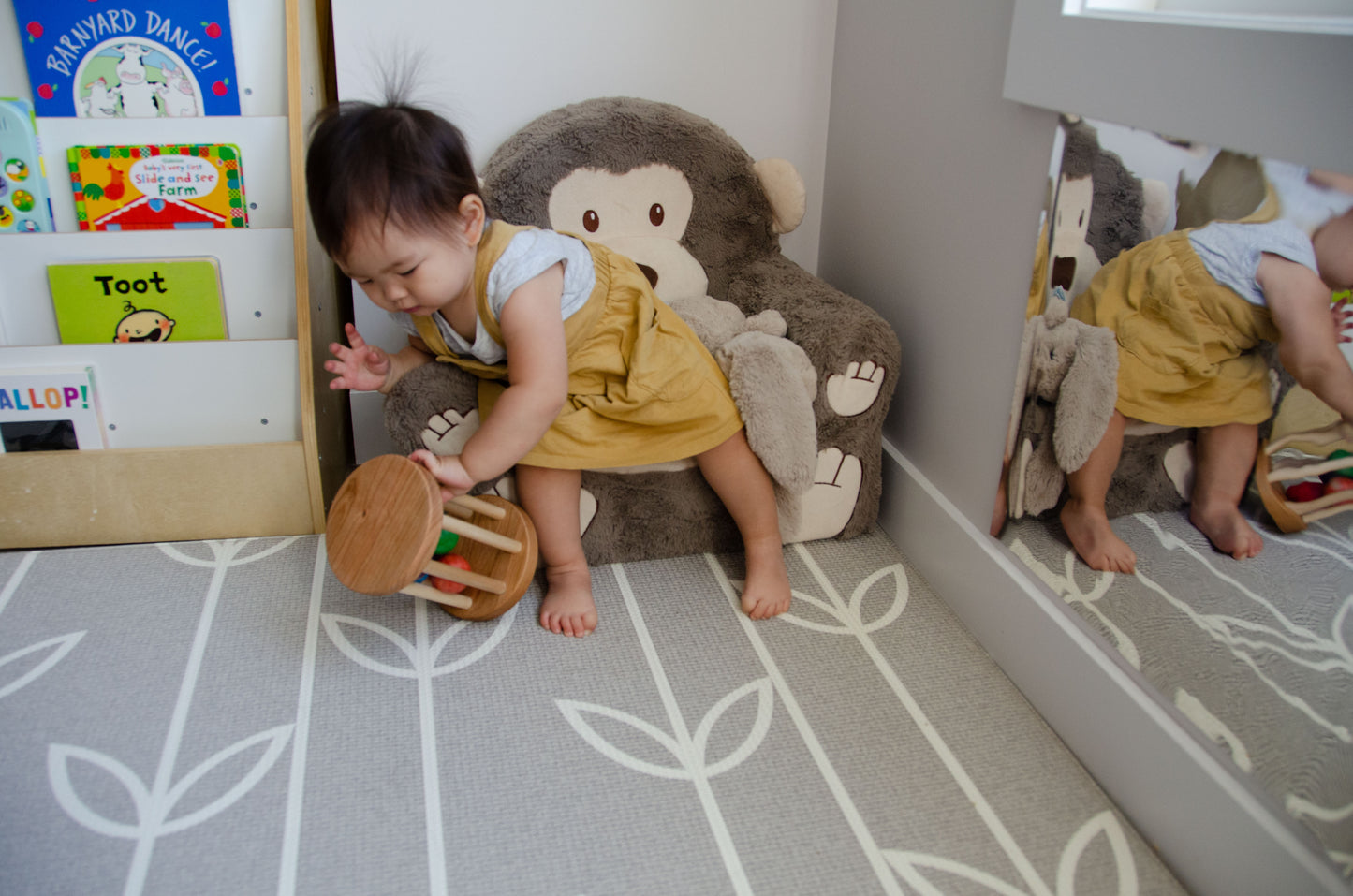 The little girl is fully engaged in playing with the Qualitmonti - Color Ball Cylinder. With joy and fascination, she explores the colorful balls, fitting them into the cylinder, and observing how they move and interact. This interactive and educational play helps her develop her motor skills, spatial awareness, and cognitive abilities as she learns about colors, shapes, and cause-and-effect relationships. Her imaginative play with the toy fosters creativity and learning in a fun and enjoyable way.