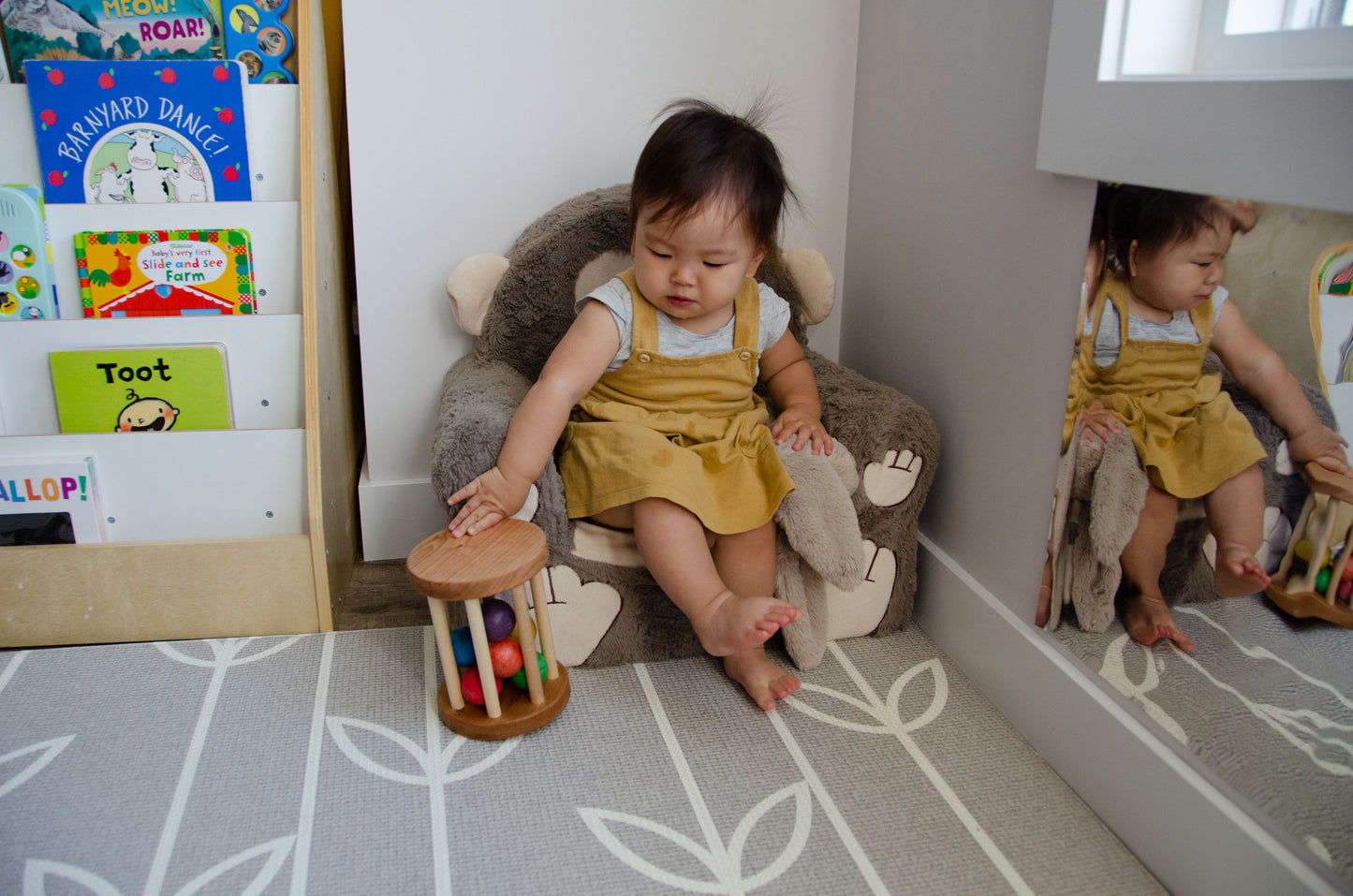 The little girl is fully engaged in playing with the Qualitmonti - Color Ball Cylinder. With joy and fascination, she explores the colorful balls, fitting them into the cylinder, and observing how they move and interact. This interactive and educational play helps her develop her motor skills, spatial awareness, and cognitive abilities as she learns about colors, shapes, and cause-and-effect relationships. Her imaginative play with the toy fosters creativity and learning in a fun and enjoyable way.