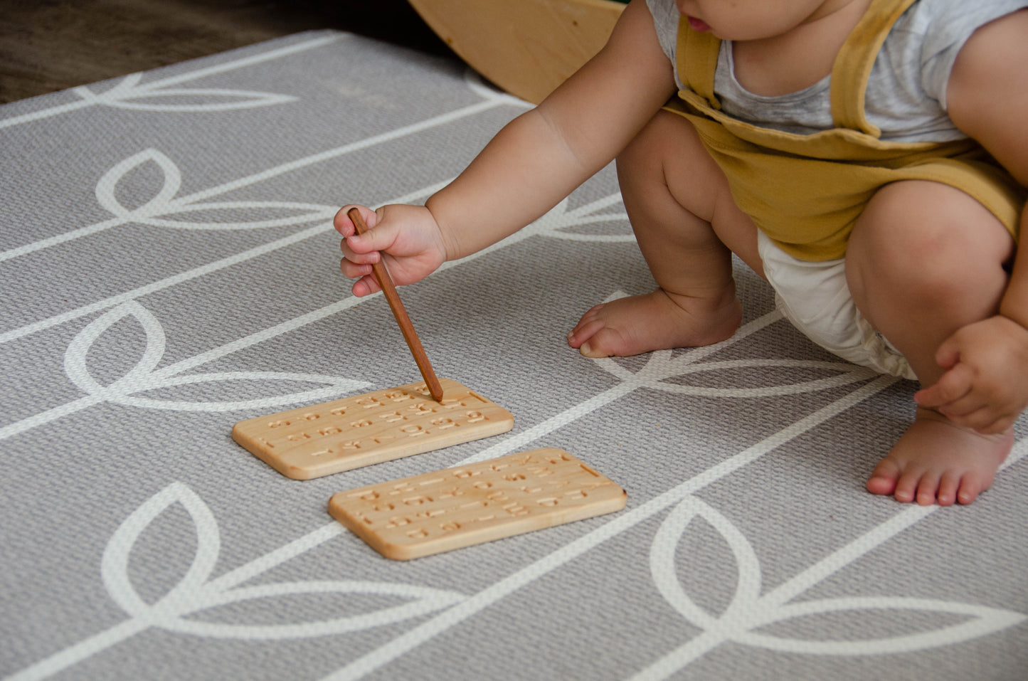 A sweet little girl confidently holding a wooden pen and using iDoddle to practice writing numbers. With focus and determination, she explores the world of numerals, building her fine motor skills and number recognition in a playful and interactive manner. Her curiosity and early learning efforts are a testament to the wonders of childhood exploration and imagination.