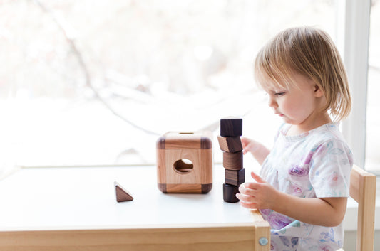 Little girl playing Cubos Montessori Toy - Cubos Lite