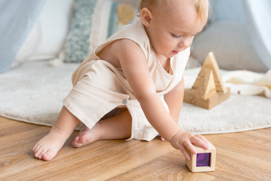 Baby playing montessori toy