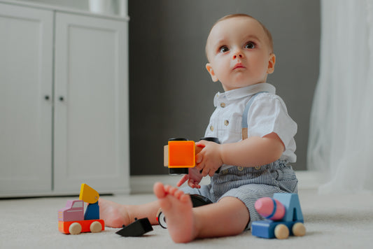 Baby playing toys look curious