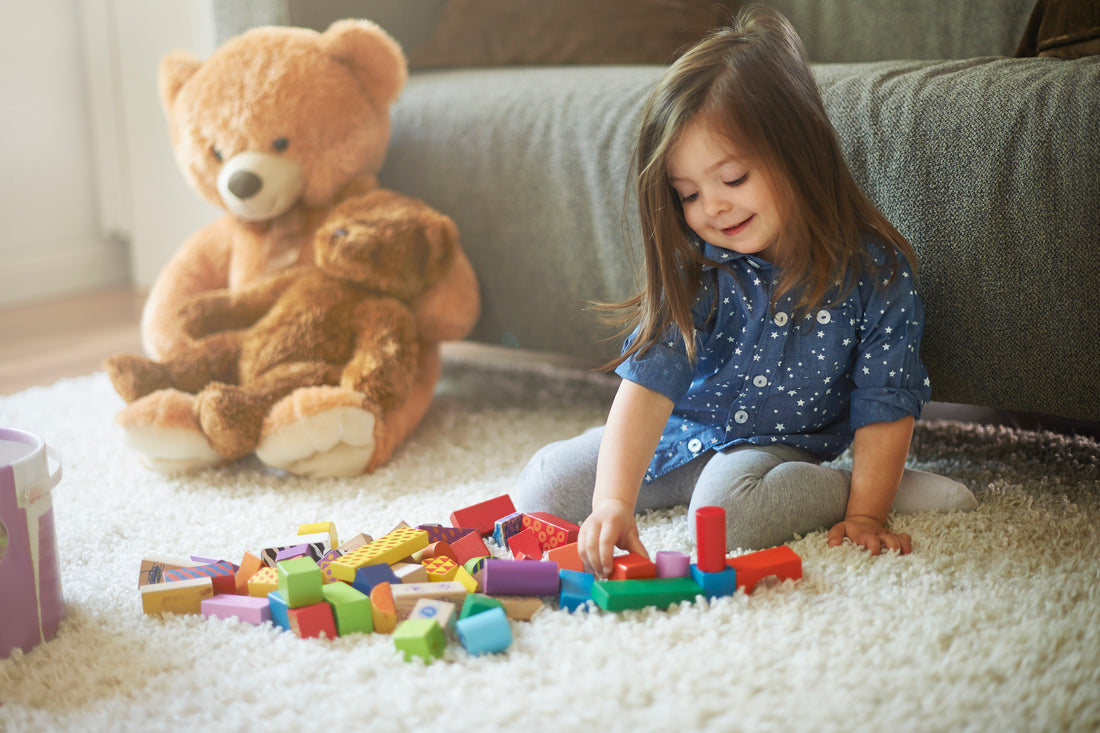 Little girl playing montessori toys