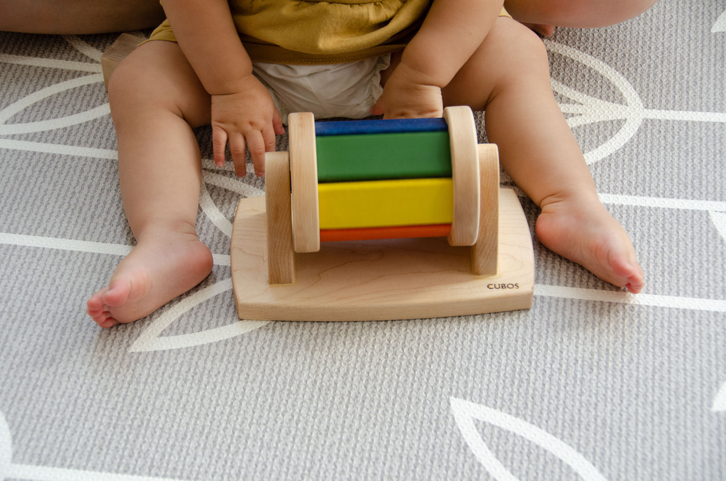 The little girl is joyfully playing with a spinning wheel toy. With excitement and wonder, she spins the wheel, watching it whirl around and captivated by its motion. This interactive playtime engages her senses and fosters her fine motor skills as she explores the spinning action and its effects. Her imaginative play with the spinning wheel sparks curiosity and creativity, making playtime a delightful and enriching experience for her.