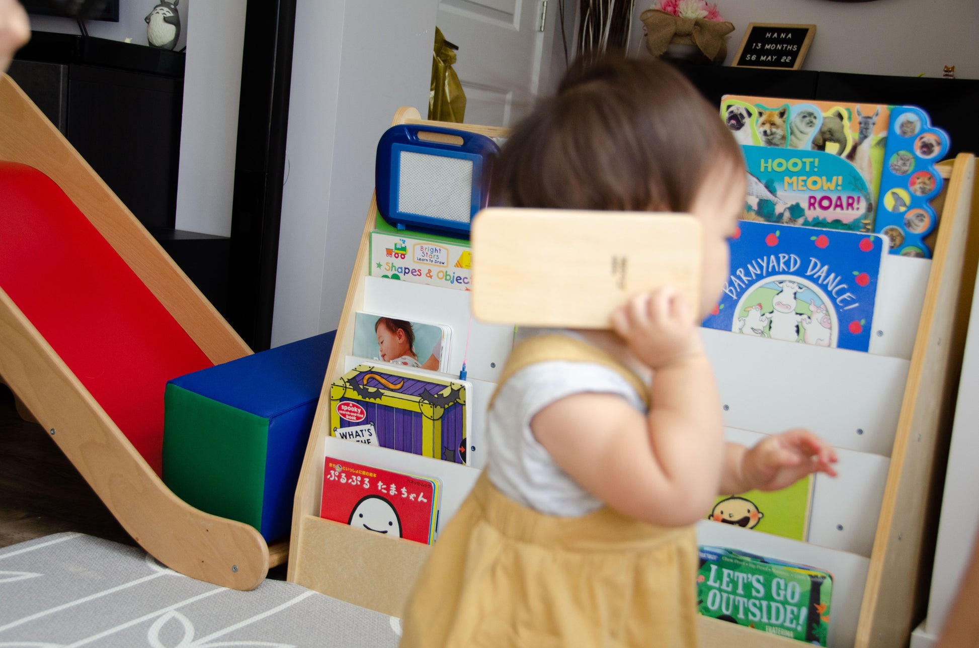 The adorable little girl is having a wonderful time playing with her iDoddle. She uses it to draw, write, and explore her creativity, but also enjoys pretending that the iDoodle is a phone. With her imagination at play, she engages in delightful conversations and imaginative scenarios, making the most out of her cherished wooden toy. This kind of play fosters her artistic skills, communication abilities, and imaginative thinking, providing a fun and enriching experience for her.