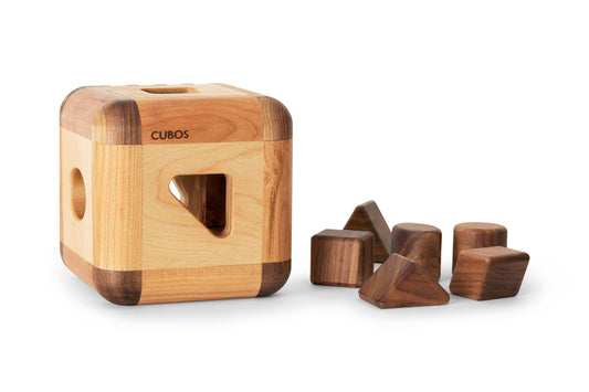  Cubos Lite - A wooden shape sorting toy featuring a compact and simplified design, ideal for promoting shape recognition and fine motor skills in Montessori education.