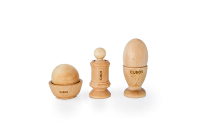 Ball, Bowl, Peg, and Egg Cup - A set of wooden sensory toys including a ball, a bowl, a peg, and an egg cup, offering tactile exploration and fine motor skill development in Montessori education